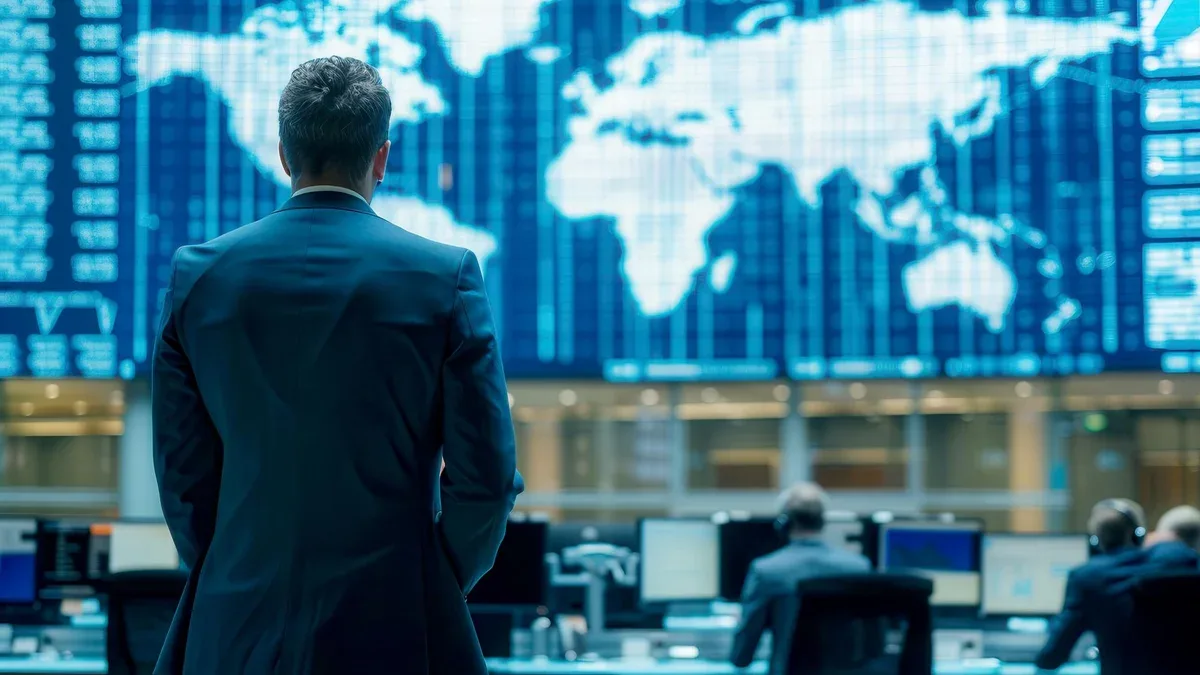 Exécutif analysant des données mondiales dans la salle de contrôle financier
